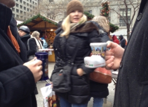 Nov. 26, 2013, Chicago – Nick Dibona brought his 2012 boot-shaped mug to the Christkindlmarket in Daley Plaza instead of conforming to the newly designed skinny souvenir mug. “At first I was a little skeptical because I love the boot, but now that I see them up close they’re not bad,” he says. (Alix Hines/Medill)