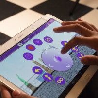 Each Siggy is controlled by the SugarCoded app, which is where the coding part comes in. Using the app's joystick, kids can roll the dolls across the floor or they can use coding blocks to complete various missions. (Alix Hines/CIRCA)